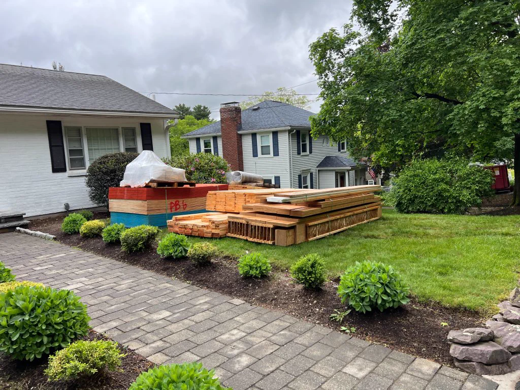 Rear addition with deck and paver patio in Canton, MA