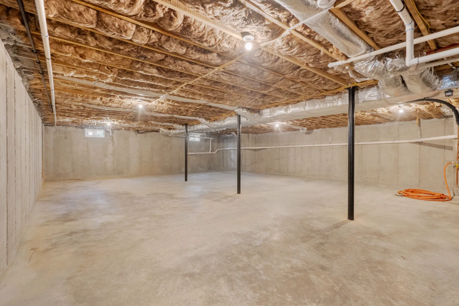 Full unfinished basement with poured walls and lally columns