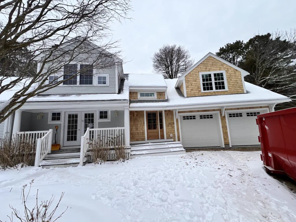 Completed addition and garage on a Massachusetts cape home by Makyson Building Company
