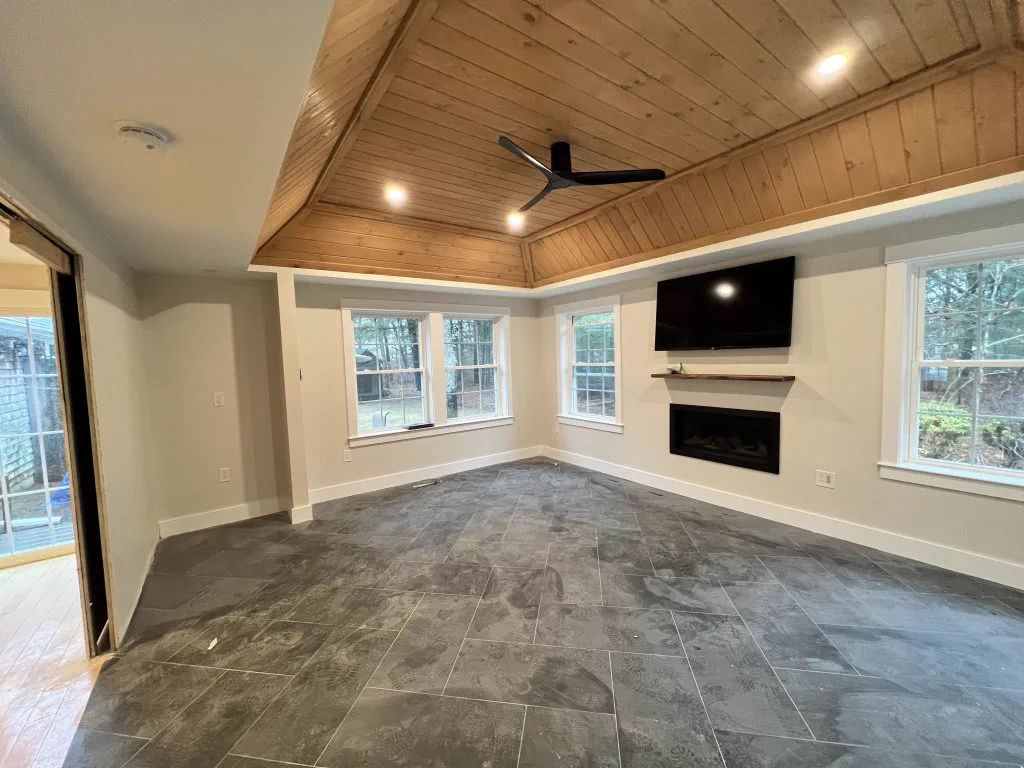Finished interior living space with wood-clad ceiling built by Makyson Building Company